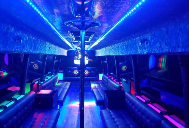 Interior view of the Red Dragon Party Bus in Manila showing full layout, LED lighting, and accents.
