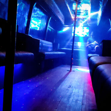 Interior view of the Red Dragon Party Bus in Manila showing full layout, LED lighting, and luxury seating