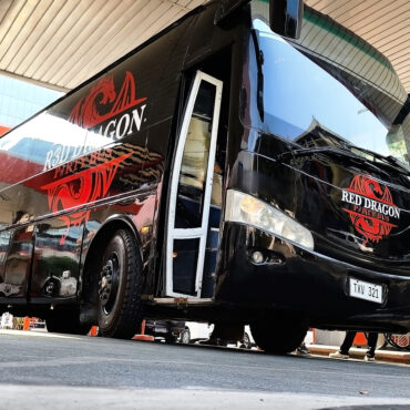 Red Dragon Party Bus front side view parked with custom design in the Philippines