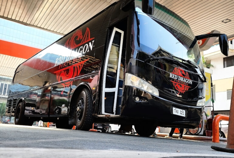 Red Dragon Party Bus front side view parked with custom design in the Philippines