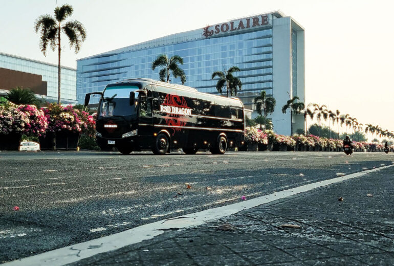 Red Dragon Party Bus in Manila showing full exterior side view with custom design